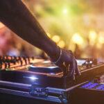 Dj mixing outdoor at beach party festival